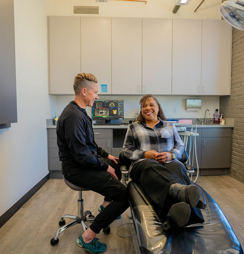 Dentists consulting with Patient