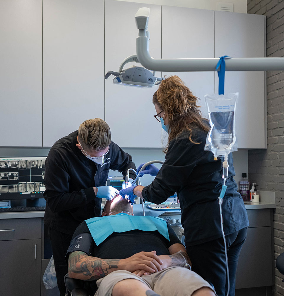 dentist in the middle of dental procedure