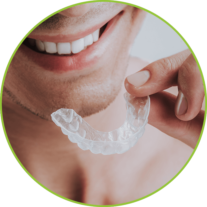 man putting a mouthguard in his mouth