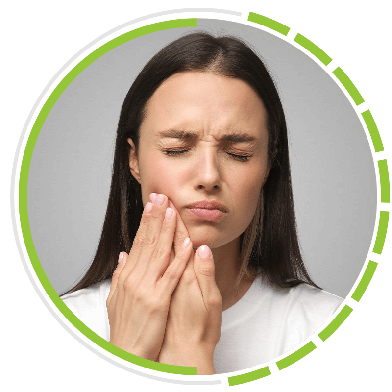 woman holding jaw in pain